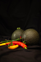 round courgettes and bright hot peppers