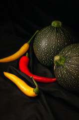 round courgettes and bright hot peppers