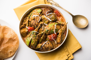 Undhiyu is a Gujarati mixed vegetable dish, specialty of Surat, India. Served in a bowl with or...