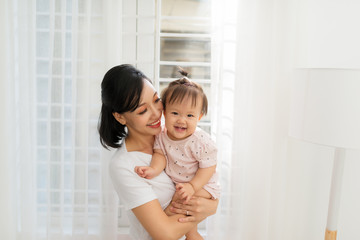Happy Mother and daughter hugging