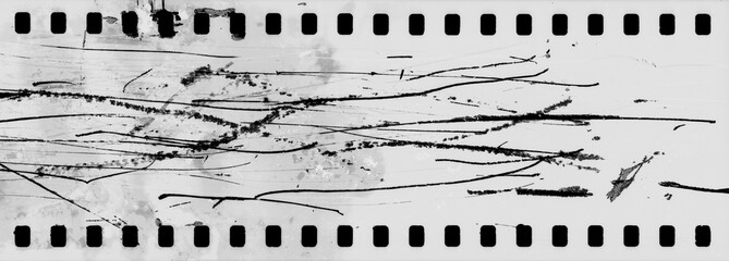 Blank grained and scratched film strip texture background.  old film effect