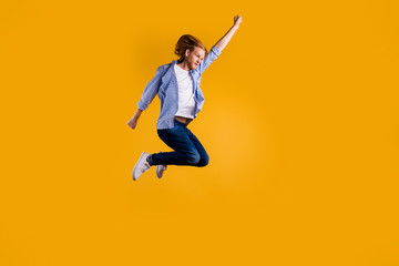 Full size photo of crazy redhead guy jumping high using super power to fly faster and save world wear casual trendy outfit isolated yellow background