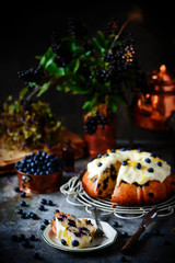 Obraz na płótnie Canvas Blueberry bund cake with cream cheese frosting..style rustic