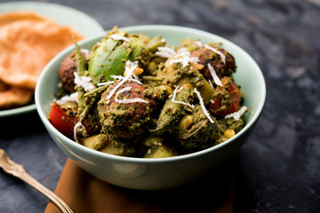 Undhiyu is a Gujarati mixed vegetable dish, specialty of Surat, India. Served in a bowl with or without poori