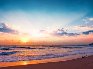 Fototapeta na wymiar World environment day concept: Colorful ocean beach sunrise