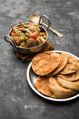 Undhiyu is a Gujarati mixed vegetable dish, specialty of Surat, India. Served in a bowl with or without poori