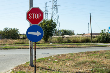 Two traffic signs at an intersection: Stop and right
