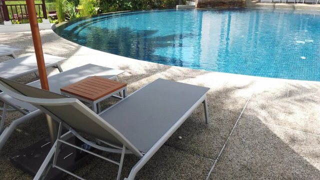 umbrella and chair around outdoor swimming pool in Luxury Hotel Resort Near sea and beach