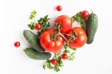 Flat lay composition with fresh cucumber, green-stuff and tomatoes on white background with copy cpace