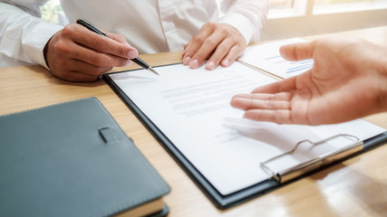 Business team brainstorming and discussing with financial data and report graph. Teamwork meeting working concept.