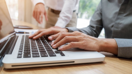 Business team brainstorming and discussing with financial data and report graph. Teamwork meeting working concept.