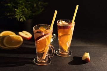 Refreshing spanish fruit sangria (punch) on black background.