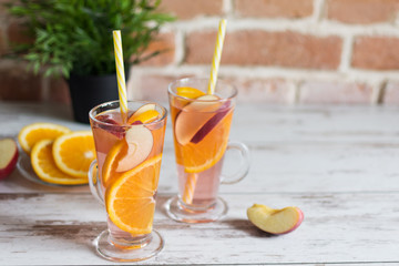 Refreshing spanish fruit sangria (punch) on wooden background.