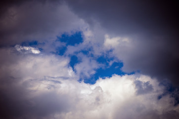 Fototapeta premium Stormy Clouds and Blue Sky Background. Design Pattern and Texture.