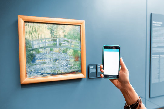 27 July 2019, Orsay museum, Paris, France: Smartphone Audioguide application of museum visitor can recognize painting and artist