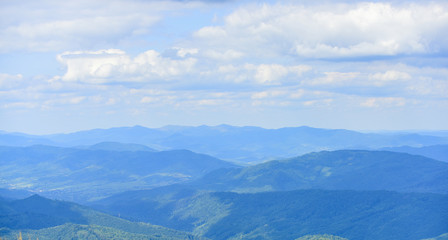 Obraz premium Landscape backdrop copy space. Scenery landscape hills with clouds. Travel and wanderlust concept. Landscape of mountains and valleys. Mountains covered with forest. Beautiful background