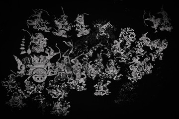 The Ramakian (Ramayana) mural paintings color black and white along the galleries of the Temple of the Emerald Buddha, grand palace or wat phra kaew Bangkok Thailand