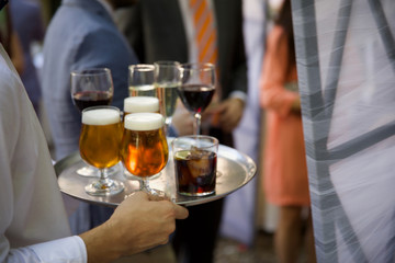 bartender pouring beer into glass