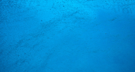 Photography of emerging bubbles in blue water