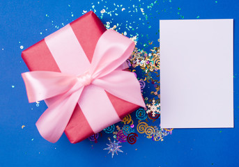Gift box on a beautiful blue background . Holiday concept
