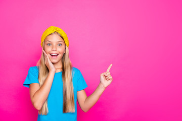 Portrait of amazed crazy funny funky child point index finger copy space impressed scream wow omg wear blue t-shirt clothes isolated over pink color background