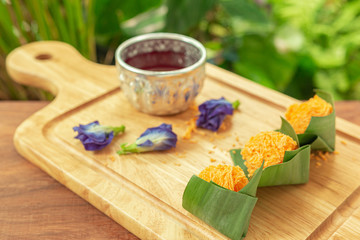 Foi Thong,  (Shredded Egg Yolk Tart) Thai desserts ingredients, used Egg yolks and sugar are boiled in sweet syrup and then formed into hairlike shapes on wood-board. Selective focus