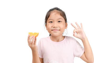 little cute asian girl smile and holding a sliced orange