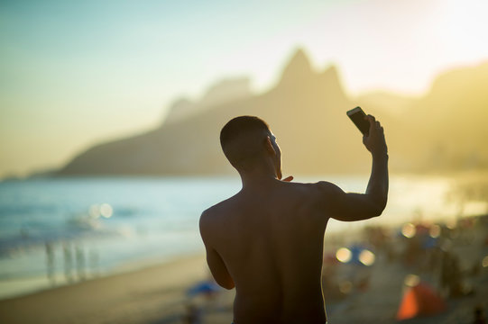 Scenic sunset view attracting selfies in Ipanema Beach in Rio de Janeiro, Brazil