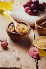 Ingredients for body scrub of brown sugar with grape and  oil, eco bio friendly cosmetic for skin care.