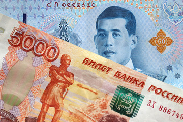 Thai baht and russian ruble bills. Concept of trade between Thailand and Russia, tourism, exchange rate, economy and investment