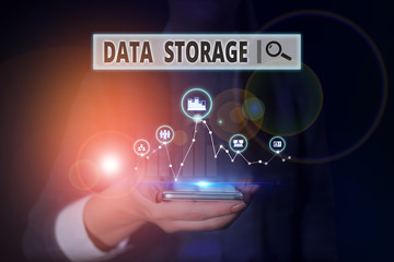 Word writing text Data Storage. Business photo showcasing the act of archiving data in electromagnetic or other forms Woman wear formal work suit presenting presentation using smart device