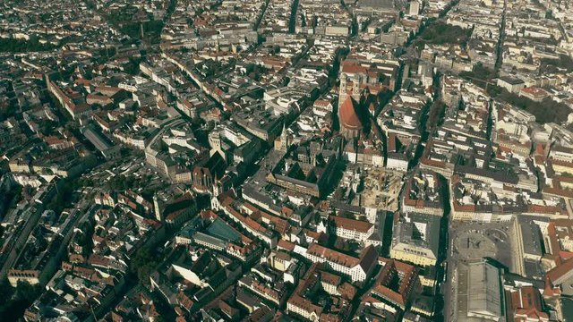 High altitude aerial shot of Munich involving famous Max-Joseph-Platz square and Frauenkirche church, Germany