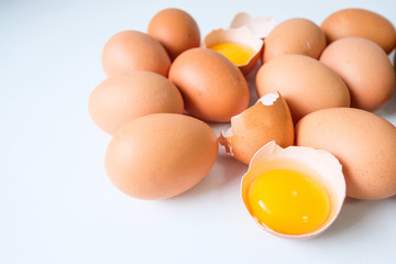 Fresh eggs from the farm placed on a white wooden table background