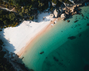 Aerial view of a tropical paradise beach with white sand and clear water in Nature Park Arrabida in Setubal, Portugal.