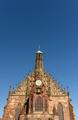 Fototapeta na wymiar The Our Lady's church (Frauenkirche) at the Nürnberg Hauptmarkt (central square) in Nuremberg, Germany.
