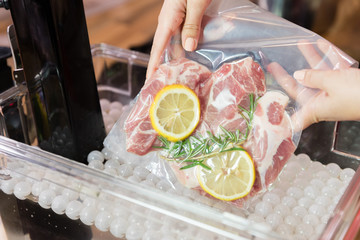 Preparing food in sous vide cooker.