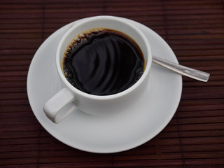 cup of coffee on wooden table
