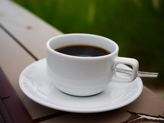 cup of coffee on wooden table