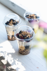 Chia pudding with yogurt, blackberries, raspberries, bananas and oatmeal served in cups