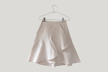 ์Linen natural fabric Short magenta mini skirt on clean background.