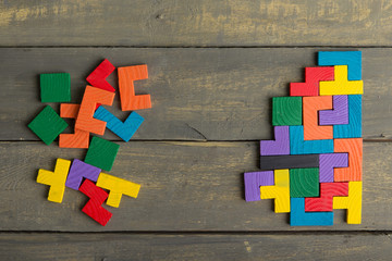 Creative solution for idea - business concept, jigsaw puzzle on the wooden desk