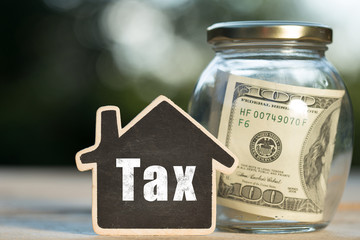 Tax written on the little house shape tag - real estate concept