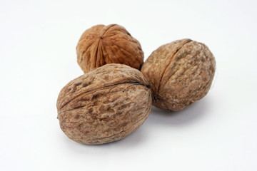 Ripe dry walnuts isolated on a light background. Concept natural, healthy food