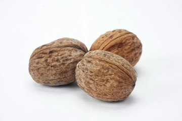 Ripe dry walnuts isolated on a light background. Concept natural, healthy food
