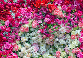 Colorful artificial roses for the background.