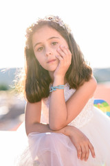 Thoughtful little girl outdoors