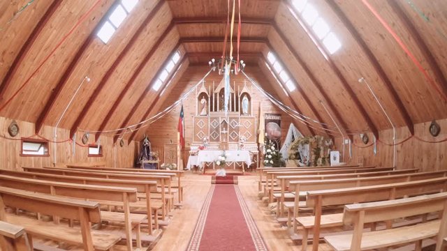 CHILOE ISLAND, CHILE - CIRCA FEBRUARY 2019: Inside of a wooden church of Chilo&eacute; island represent a unique example in Latin America of an outstanding form of ecclesiastical wooden architecture. 4k