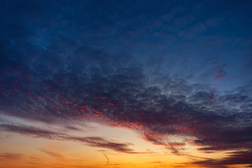 Beautiful colorful sunset with cumulus clouds.