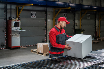 Warehouse worker working on a conveyor line