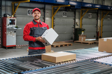 Warehouse worker working on a conveyor line